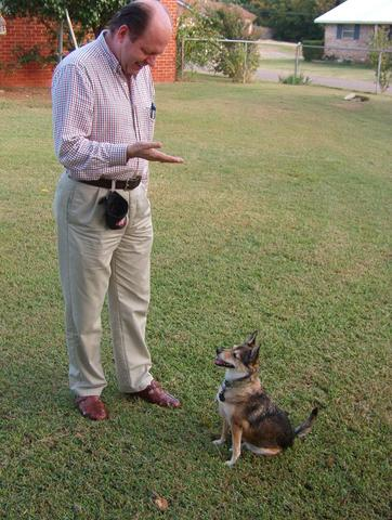 Jerry and "Rojita" demonstrating "Sit" with an underhand signal